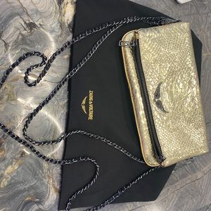 Metallic foldover chain strap bag in gold, crossbody